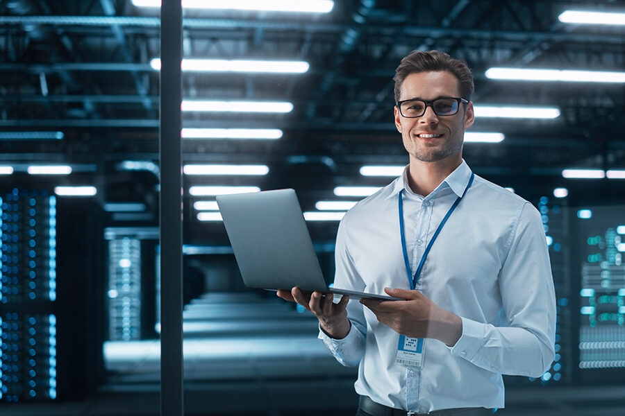 Late at Night in Private Office Male Businessman Works on a Laptop